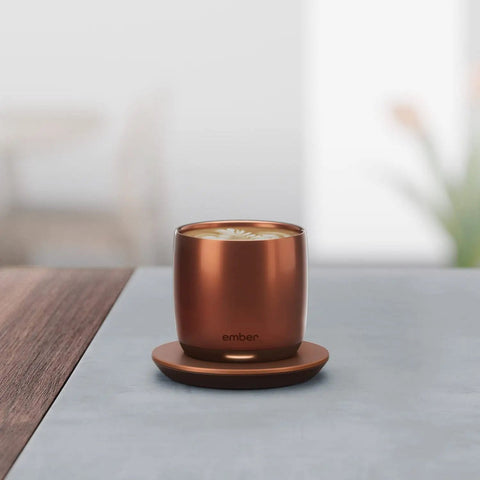 Renewed 6 Oz Smart Heated Coffee Mug With App Precision Temp Control And Solid Battery Life Keeps Your Favorite Brew Piping Hot And Ready For All Day Sipping Sessions on a table.