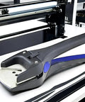 Deluxe Corner Rounder Punch Pro Grade 2.5mm Radius Heavy Duty Handheld Cutter tool on a table for PVC cards and laminated sheets.