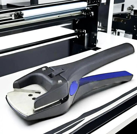 Deluxe Corner Rounder Punch Pro Grade 2.5mm Radius Heavy Duty Handheld Cutter tool on a table for PVC cards and laminated sheets.
