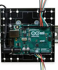 Rack Ready DIN Rail Universal Mounting Plate 4 Inch By 6 Inch With 68 Pre Drilled Holes Clips Onto 35 mm Rail Steel Bracket RoHS Compliant Industrial Mounting Platform For Devices with an electronic board attached.