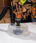 Front view of Klein Tools adjustable circle hole cutter with dust bowl and vacuum hose on drywall surface