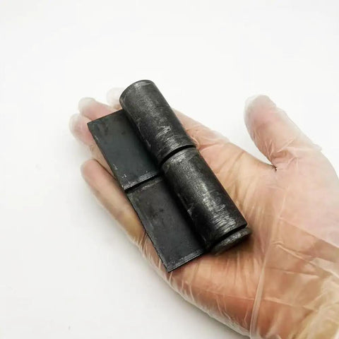 Heavy Duty Weld On Hinges 4 Pack Rock Solid Steel Hinges With Removable Pin in hand, showing black carbon steel design.