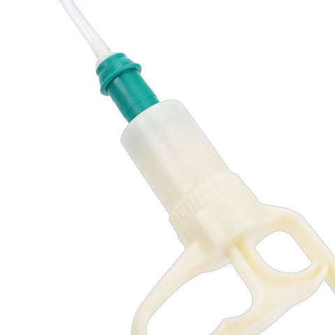 Close-up of Manual Milking Machine With Two Thousand Milliliters Stainless Steel Bottle Portable Milking Kit handle and suction tube.