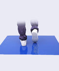 Industrial Grade Grabby Tacky Mats 300 Sheets 10 Pack Super Sticky Adhesive Floor Rollups For Construction Sites And Warehouses 45X90 Cm feet stepping on blue sticky mat.