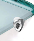 Close-up of a silver bracket from 20Pcs Zinc Alloy Shelf Pegs for Glass Cabinet Shelves, Easy Manual Install, on a glass corner