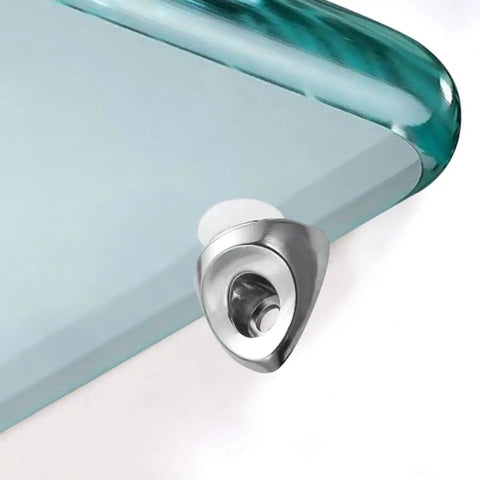 Close-up of a silver bracket from 20Pcs Zinc Alloy Shelf Pegs for Glass Cabinet Shelves, Easy Manual Install, on a glass corner