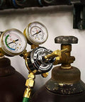MIG welder regulator kit with brass dual-gauge regulator attached to Argon/CO2 cylinders