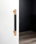 Matte Black And Champagne Bronze Knurled Cabinet Pulls Set Of 10 With 5 Inch Hole Centers installed on white cabinet door