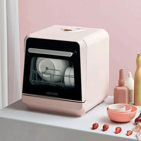 Fully Automatic Countertop Dishwasher With 5L Built In Water Tank And Inlet Hose featuring a pink compact design and plates inside.