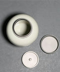 Top Shelf Ceramic Tea Canister With Airtight Lock Lid and Solid Loose Leaf Tea Storage Jar, top view with lids.
