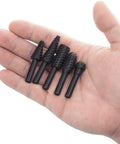 Five Piece One Quarter Inch Rotary Rasp Drill Bit Set With 6mm Shanks Pro Grade Heavy Duty in a hand for size reference.
