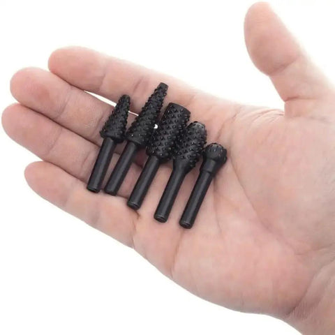 Five Piece One Quarter Inch Rotary Rasp Drill Bit Set With 6mm Shanks Pro Grade Heavy Duty in a hand for size reference.