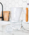 10 Cup Water Filter Pitcher with Bamboo Handle and Coconut Shell Activated Carbon Filter on kitchen counter