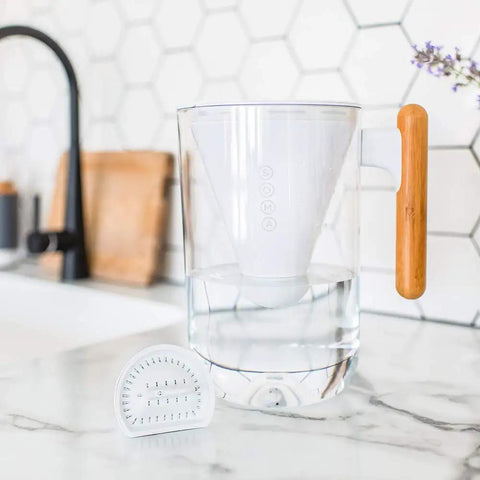 10 Cup Water Filter Pitcher with Bamboo Handle and Coconut Shell Activated Carbon Filter on kitchen counter
