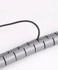 Close-up of Spiral Cable Protection Sleeve 1M Gray Wrap Organizer 32mm Diameter Tidy Tube showing wire insertion