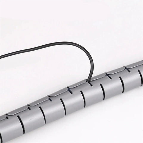 Close-up of Spiral Cable Protection Sleeve 1M Gray Wrap Organizer 32mm Diameter Tidy Tube showing wire insertion