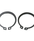 Two metal retaining rings from the 300 Piece Metal C Clip And E Ring Shaft Retaining Rings Assortment Kit With Box Fastener Set Black.