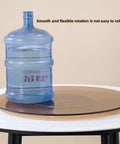 Legit Heavy Duty Tempered Glass Lazy Susan Turntable Slick Rotating Serving Tray 360 Degree Swivel with large water bottle.