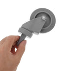 4 Piece Heavy Duty Rubber Swivel Caster Wheels With Threaded Stem And Spring Loaded Setup For Slick Rolling On Mop Buckets Trash Dolly Furniture Carts Grey, close-up of wheel in hand.