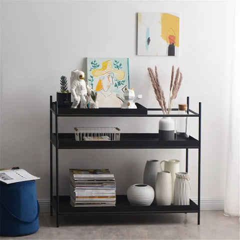 Top Shelf Iron Industrial Bookshelf Featuring a Sleek Narrow Frame Ideal for Living Room Entryways and Foyer Organization Multi Level Floor Storage Rack Totally Built Different with decor and plants.
