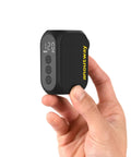 On-The-Go Mini Bike Pump With Gauge, Ultra-Compact 120 PSI Electric Inflator held in hand showing digital display