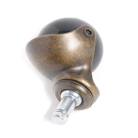 4pcs Inch Antique Bronze Ball Caster Wheel Swivel Chair Furniture close-up of a vintage-style wheel with a black ball and sturdy bronze holder.