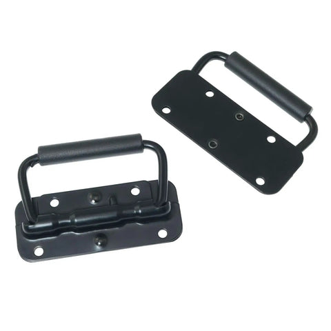 Hella Sturdy Black Spring Loaded Folding Carry Handle With Slick Rubber Grip Heavy Duty Surface Mount Brackets For Toolboxes Battery Boxes And Custom Speaker Cabs, showing two handles with rubber grips.