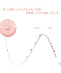 Image of a pink retractable measuring tape, dual-scale in inches and centimeters. Part of 3 Pack Retractable Tape Measures For Sewing Tailoring Crafting And Body Measurements, 60 Inch 150 Cm Go To Tool With Push Button, Double Scale Rulers, Flexible Fiberglass Tape For Precise Inches And Centimeters.