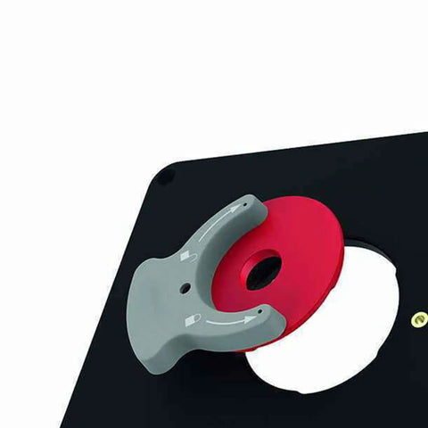 Rock Solid Metal Router Table Insert Plate Featuring Quick Adjust Centering Rings For Seamless Milling And Top Tier Woodworking Crafts Heavy Duty Workshop Essential That Just Works, showcasing gray handle and red centering ring.
