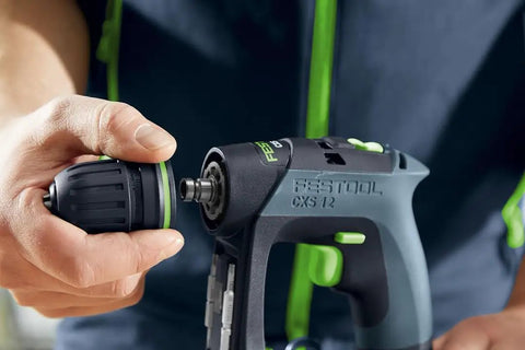 Close-up of Cordless CXS 2 Drill Kit with Centrotec in hand, showing tool attachment, built tough with smart electronics protection.