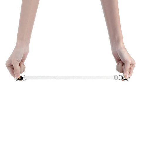 Hands holding adjustable bed sheet clips and corner straps kit for home use elastic mattress grippers and non slip fasteners to secure sheets