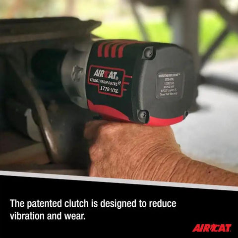 No-Bull Heavy-Duty Pneumatic Impact Wrench Pushing 1450 Foot Pounds Killer Torque And Vibrotherm Low-Vibration Composite Build For Tough Job Site Grinds in use with a focus on the patented clutch.
