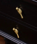 Brass Bird Knob Door Handle for Cabinets and Drawers on dark wood surface, Solid Brass Kitchen Cupboard Pull, Durable Hardware With Soft Luster