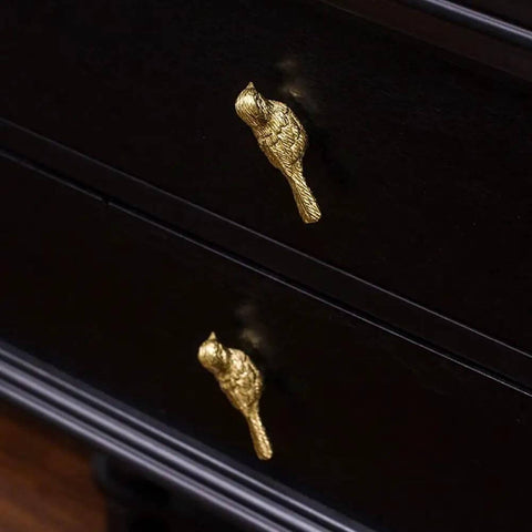 Brass Bird Knob Door Handle for Cabinets and Drawers on dark wood surface, Solid Brass Kitchen Cupboard Pull, Durable Hardware With Soft Luster