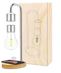 Levitating Lamp With Floating Light And Built In Qi Wireless Charger Slick Modern Night Light For Any Room Go To Vibe Gentle Warm Glow Magnetic Levitation Bulb Touch Control On Base next to packaging box