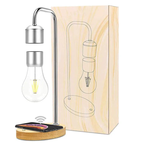 Levitating Lamp With Floating Light And Built In Qi Wireless Charger Slick Modern Night Light For Any Room Go To Vibe Gentle Warm Glow Magnetic Levitation Bulb Touch Control On Base next to packaging box