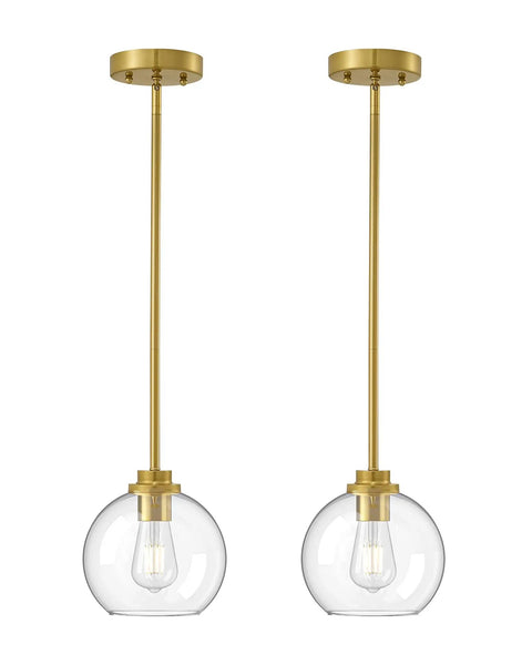 Two Pack Slick Vintage Pendant Lights With Clear Glass Globes And Gleaming Gold Canopies Adjustable Drop Length Perfect For Kitchen Islands Dining Rooms Emitting A Cozy Vibe Hardwired Installation.
