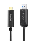 Heavy Duty 65 Foot Fiber Optic USB A To C Active Cable Cranks 10gbps Sync Speeds connected to devices with clear labeling.