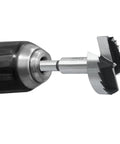 Close-up of Top Tier 2 Inch Forstner Drill Bit Robust Carbon Steel Build in a drill chuck for woodworking tasks.