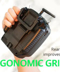 Hand holding Dope Compact Pro Radio Transmitter with Hall Gimbals and ELRS CC2500, showcasing ergonomic rear grips