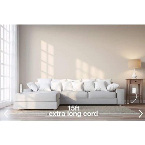Living room with sofa, showing Six Outlet Surge Protector Power Strip With 25 Foot Extension Cord Flat Plug White Low Profile Design