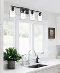 4 Light Modern Bathroom Lighting Fixtures In Matte Black Finish With Clear Glass Shades For A Bright Warm Glow over kitchen sink