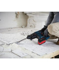 Person using Lightweight 18V Brushless SDS Plus Bulldog Rotary Hammer Bare Tool With Three Quarter Inch Chuck for tile removal
