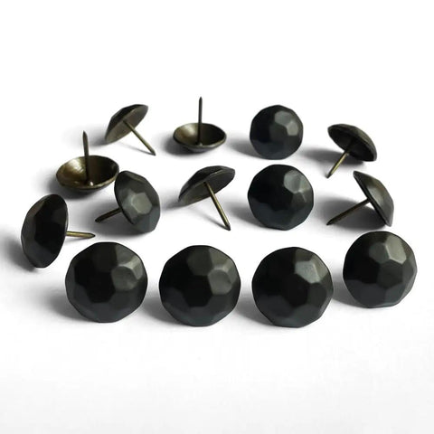 Sixty Piece Bundle Of Hella Sturdy Matte Black Upholstery Tacks Featuring A Slick One Inch Round Head Built For Sofas And Headboards A Top Shelf Boost For Furniture Flips No Fuss Installation Everyday, showing a close-up of matte black upholstery tacks.