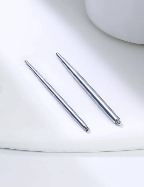 Pair of 16G Straight Piercing Taper Insertion Pins for Nose Septum Lip Rings in a 10 Piece Set on white surface