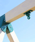 Beefy 10000 Lb Heavy Duty Swing Hanger Set For Indoor Outdoor Swing Sets showing green iron hanger on wooden beam