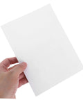 Person holding a single white sheet from Self Adhesive Wall Patch Kit With 12 Durable Vinyl Siding Patches 8.26 By 5.90 Inches Quick DIY Fix For Cracks And Holes On Walls Fences And Vinyl Siding At Home Office Or Store, showing size and material.