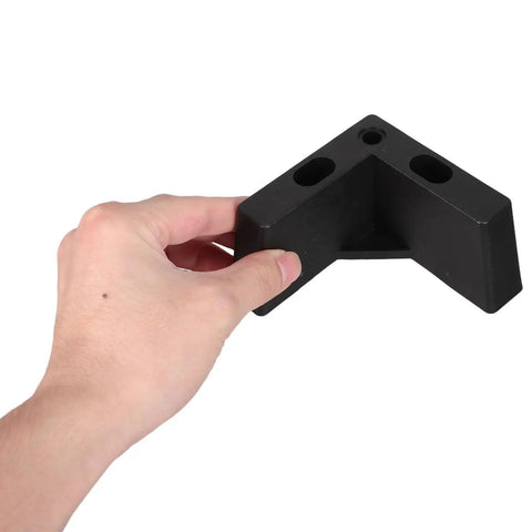 Hand holding Rock Solid Thickened Structure Plastic Furniture Legs L Shaped With M5 Screws Black Four Pack Replacement Feet