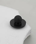 Close-up of a black 100x Rubber Feet Push In Knurled Bumpers For 1/4 Inch Holes, No Tools Needed Press Fit, durable non-slip design.
