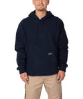 Hella Comfy Mens Flame Resistant Hoodie Sweatshirt With Heavyweight 12 5 Oz Fleece Pullover For Tough Industrial Job Site Work Wear Navy Cotton Acrylic Blend Meets Nfpa Atptv Hrc Safety Specs Xl Regular model wearing the hoodie